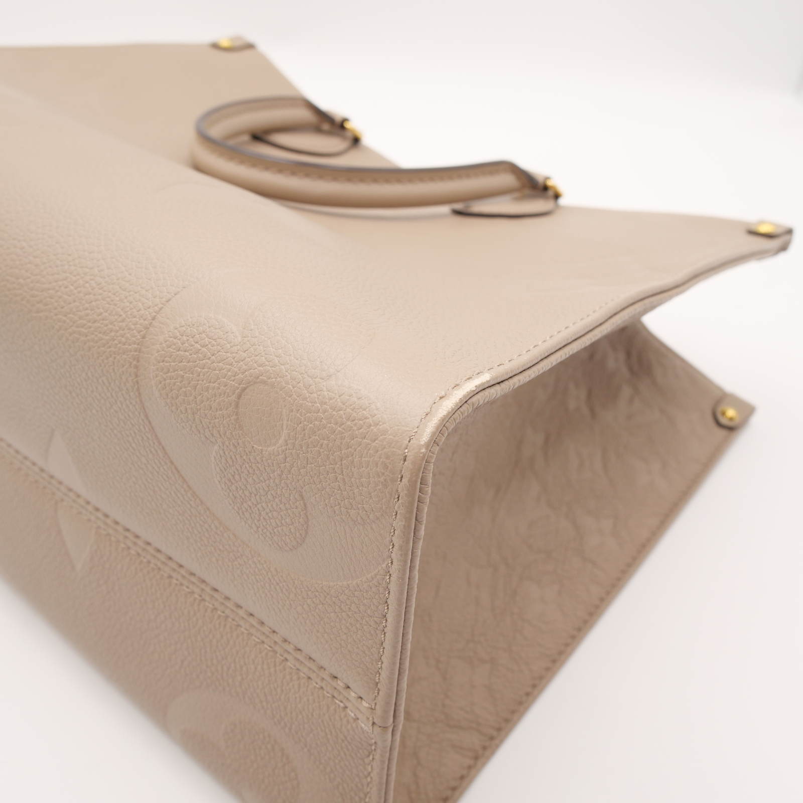 Onthego MM Monogram Empreinte Tourterelle Hand Bag