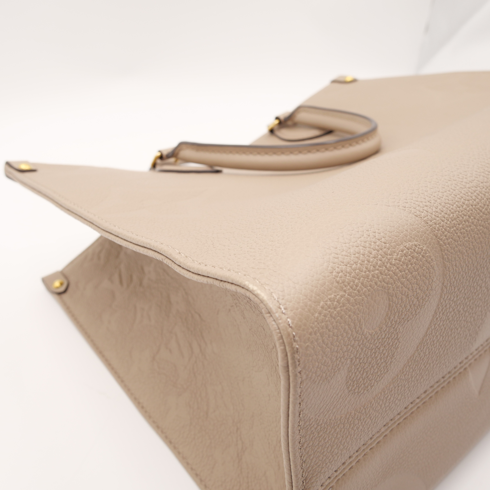 Onthego MM Monogram Empreinte Tourterelle Hand Bag