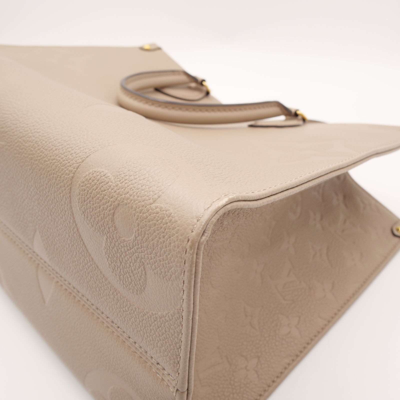 Onthego MM Monogram Empreinte Tourterelle Hand Bag