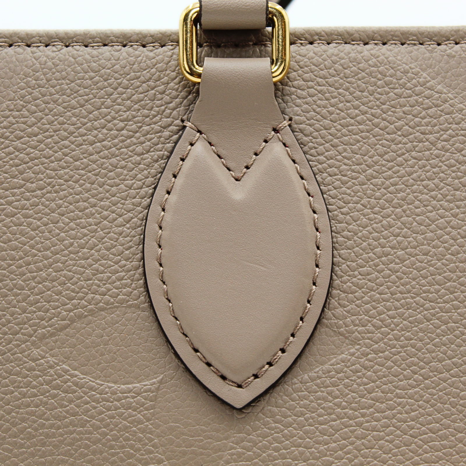 Onthego MM Monogram Empreinte Tourterelle Hand Bag